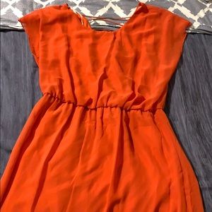 Orange dress with gold metal pieces in back